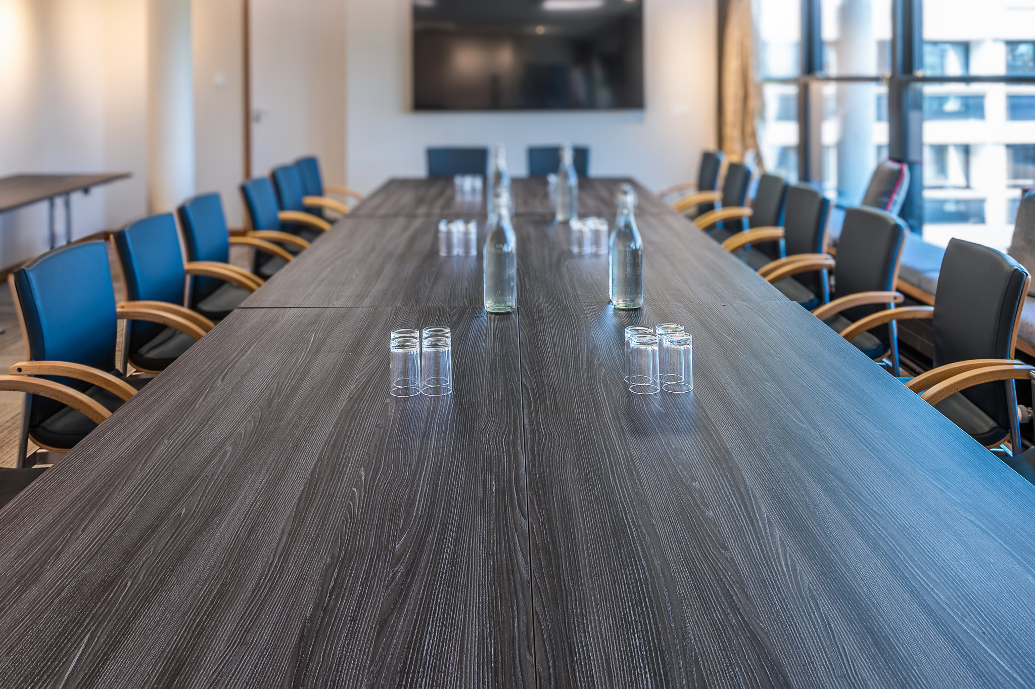 A photo of the Levett Room, set up in boardroom style with a long committee table in the centre