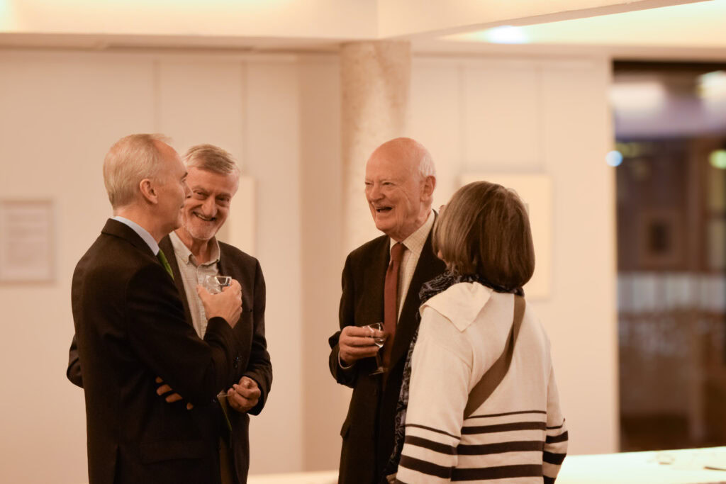 People talking at a College event