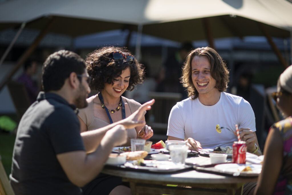 Students eating informal lunch in Harbour Quad in the sun.
