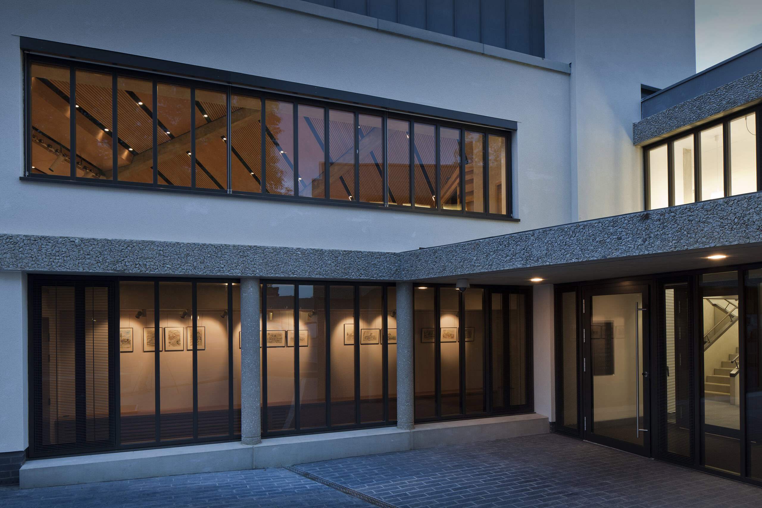 The Academic Wing of the College, a bright white building housing the Leonard Wolfson Auditorium, shot looking towards the new Porters' Lodge.