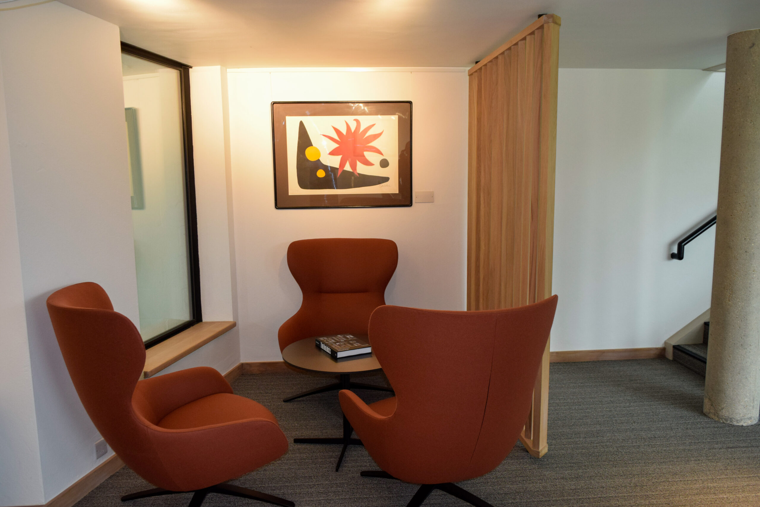 Chairs and a table arranged in the Wolfson College Lower Common Room